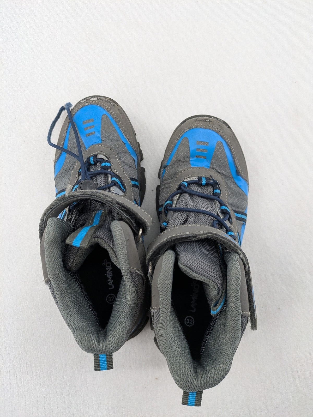 Outdoor grey and blue winter boots with high shaft, Velcro closure, and textured sole.