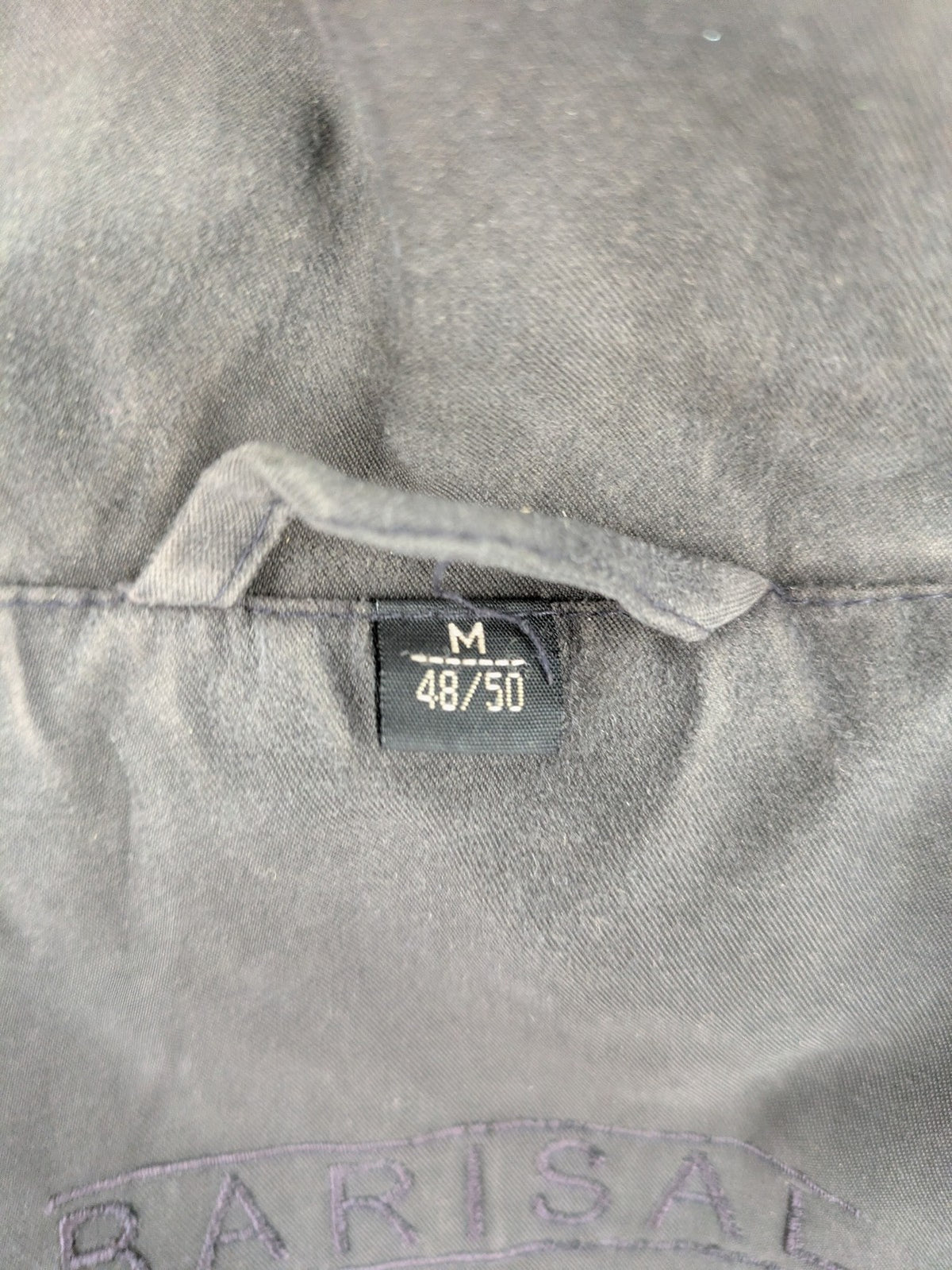 Barisal grey coat with hood, cargo pockets, and checkered lining detail.