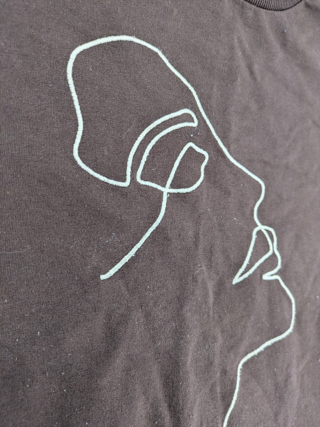 LC Waikiki green sweatshirt dress with minimalist white line art graphic and ribbed cuffs.