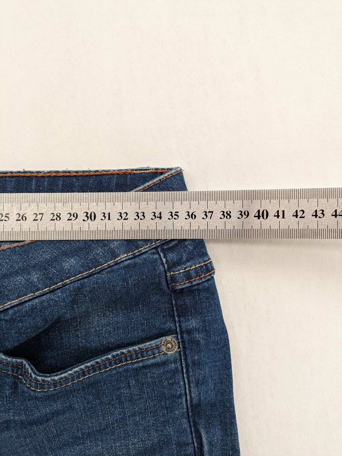 Best Connections blue skinny jeans with frayed hem and sporty side stripe.