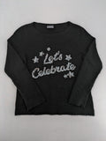 Yessica black turtle neck jumper with sequin "Let's Celebrate" graphic and star details.