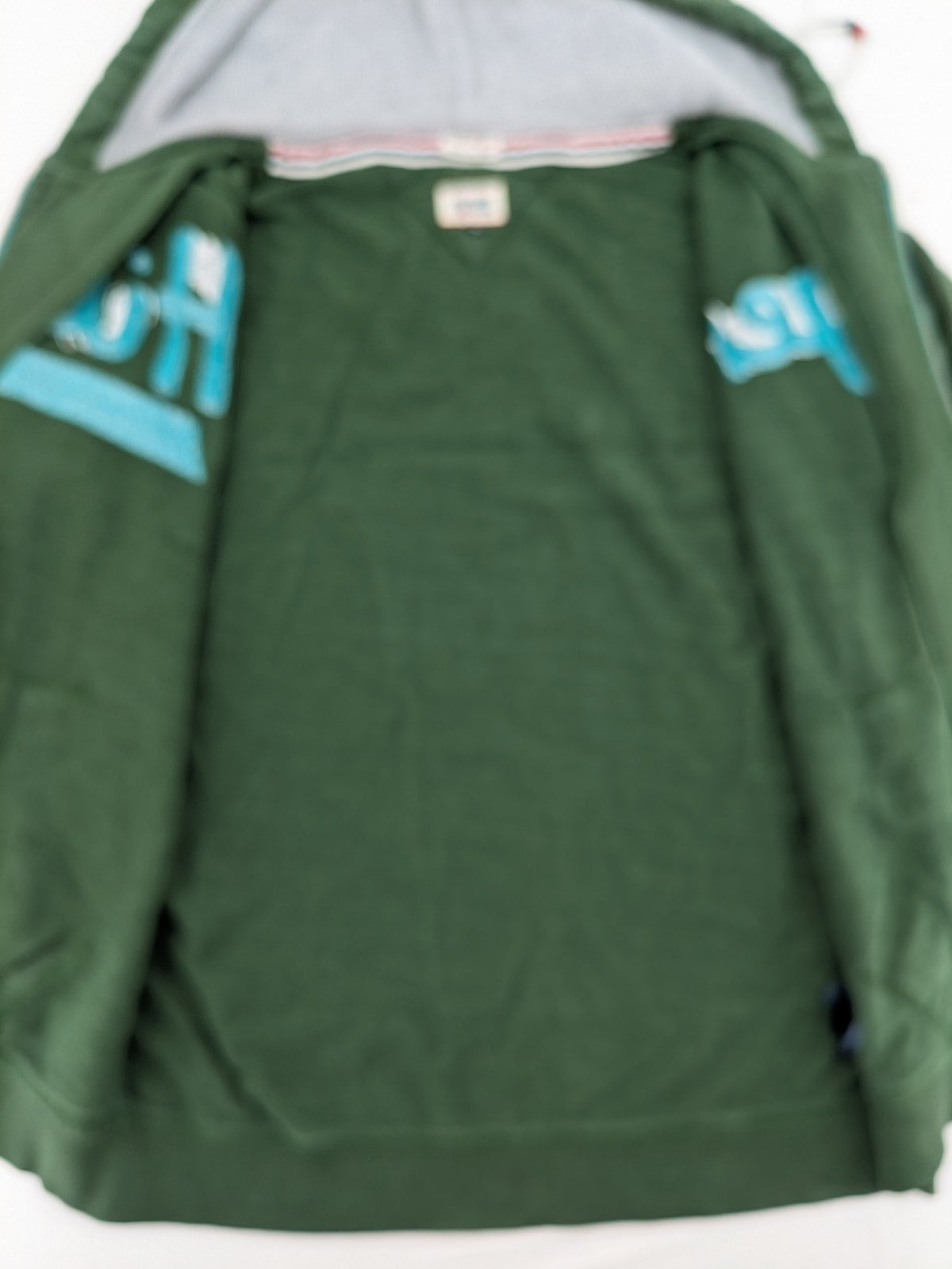 Tommy Hilfiger Denim green hoodie full zip with large graphic logo and grey waffle lining.