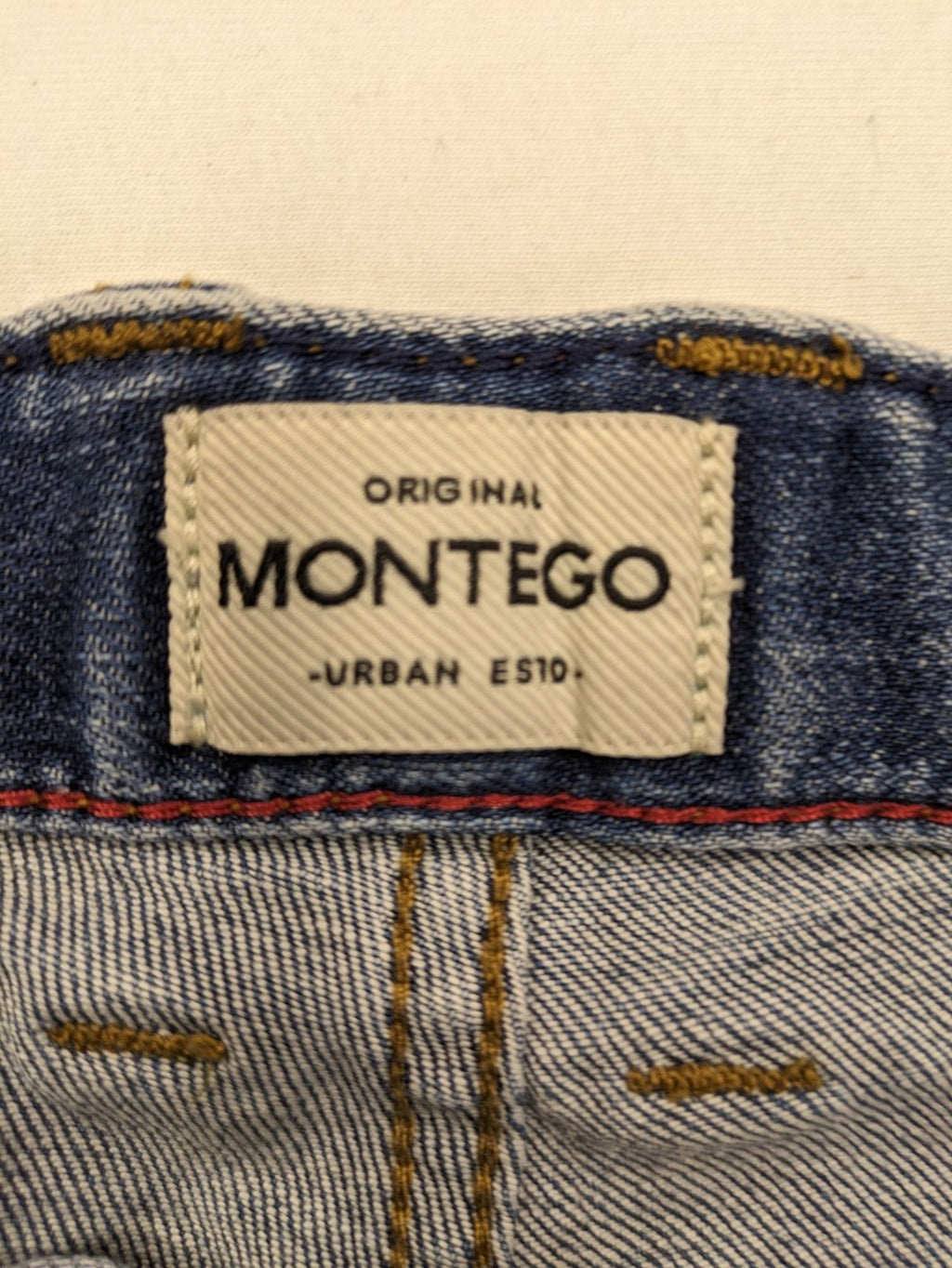 Montego blue straight jeans with stretch denim, classic design, and regular fit.