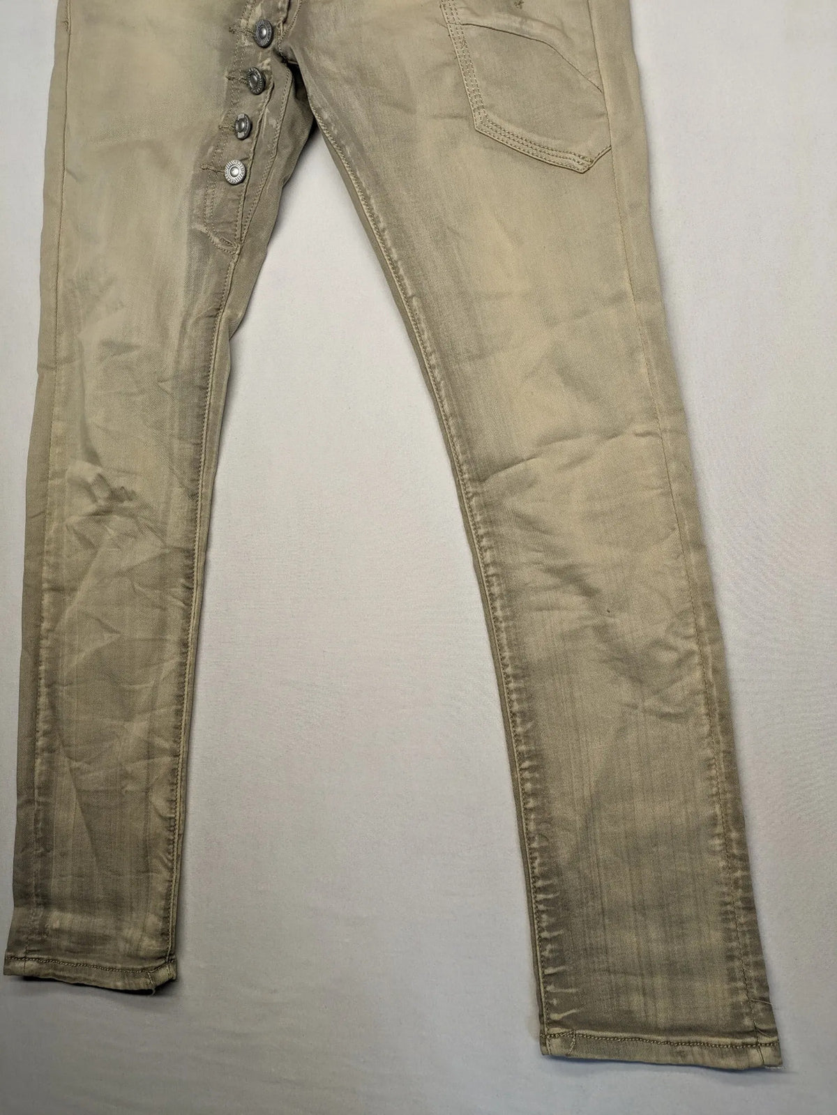 Mozaar beige straight jeans with unique asymmetrical button placket and practical pockets.