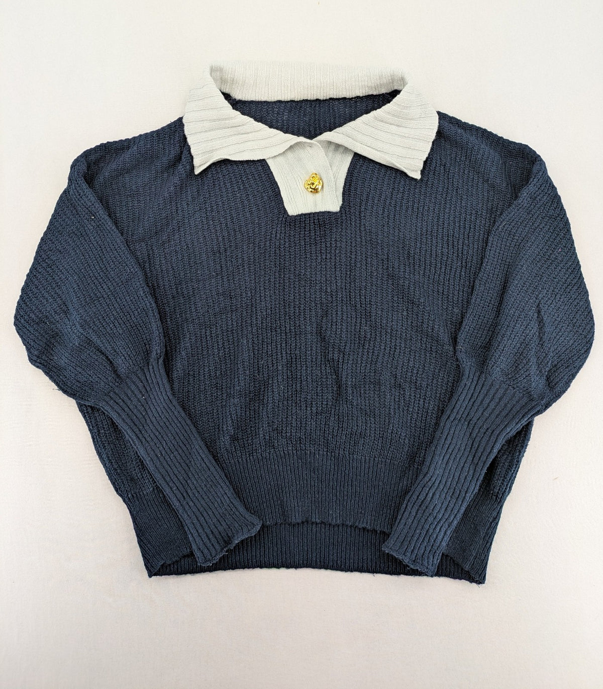 Dazy navy turtle neck jumper with contrasting collar and gold heart button detail.