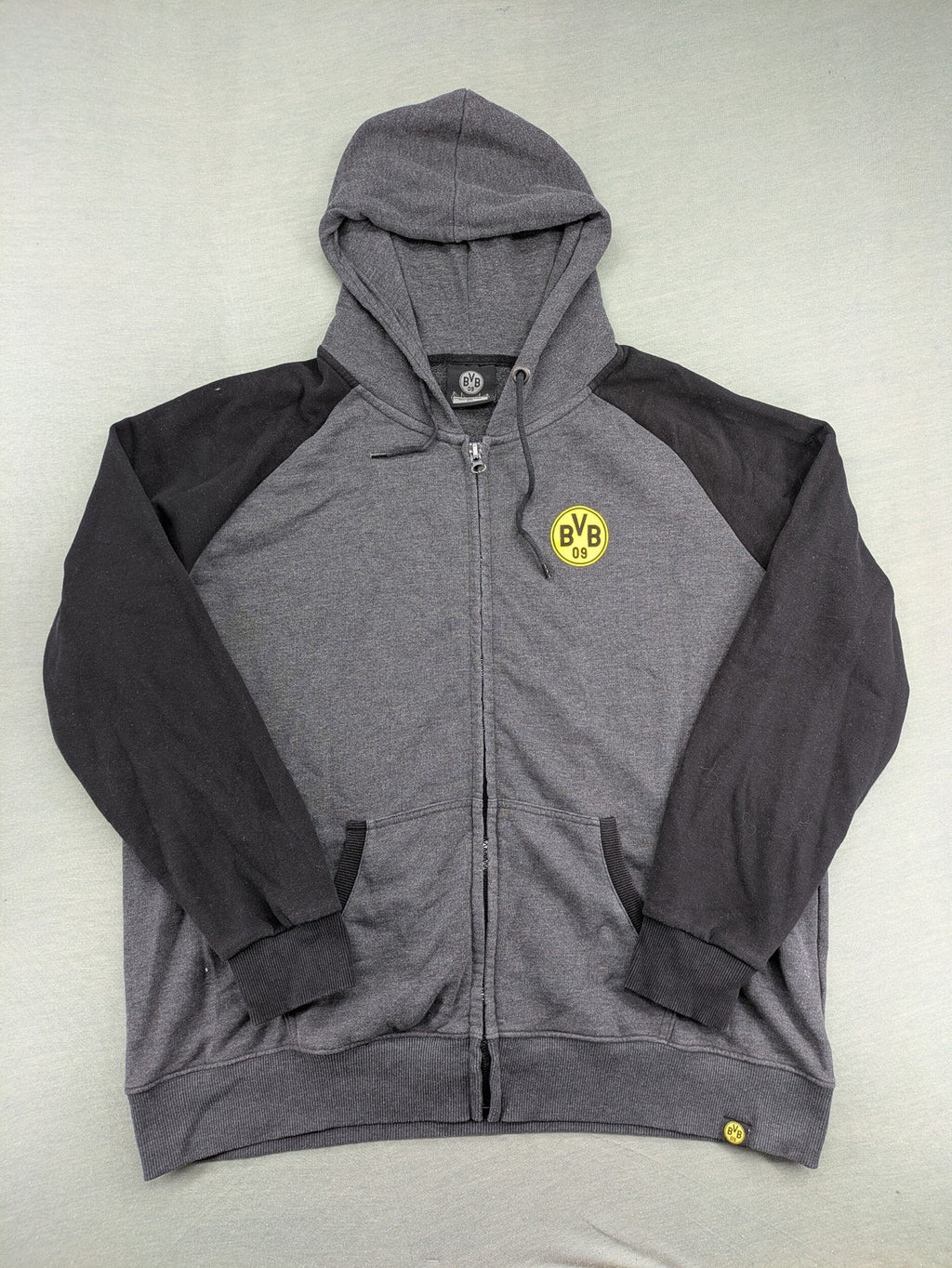 Borussia Dortmund grey and black hoodie with BVB 09 logo and full zip design.