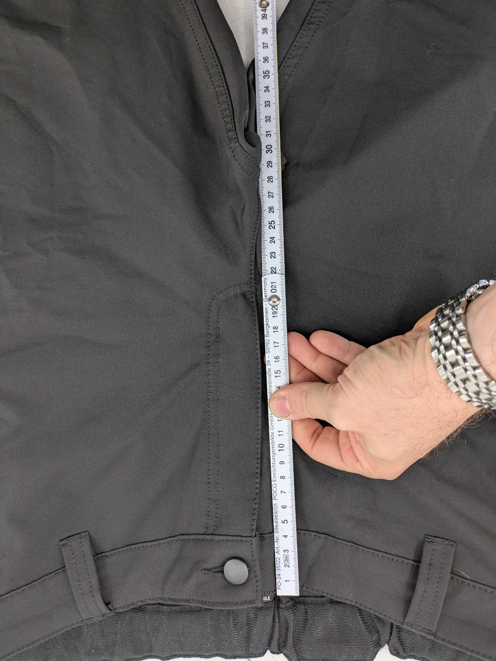 Outdoor grey trekking pants with zippered cargo pockets and durable stretch fabric.