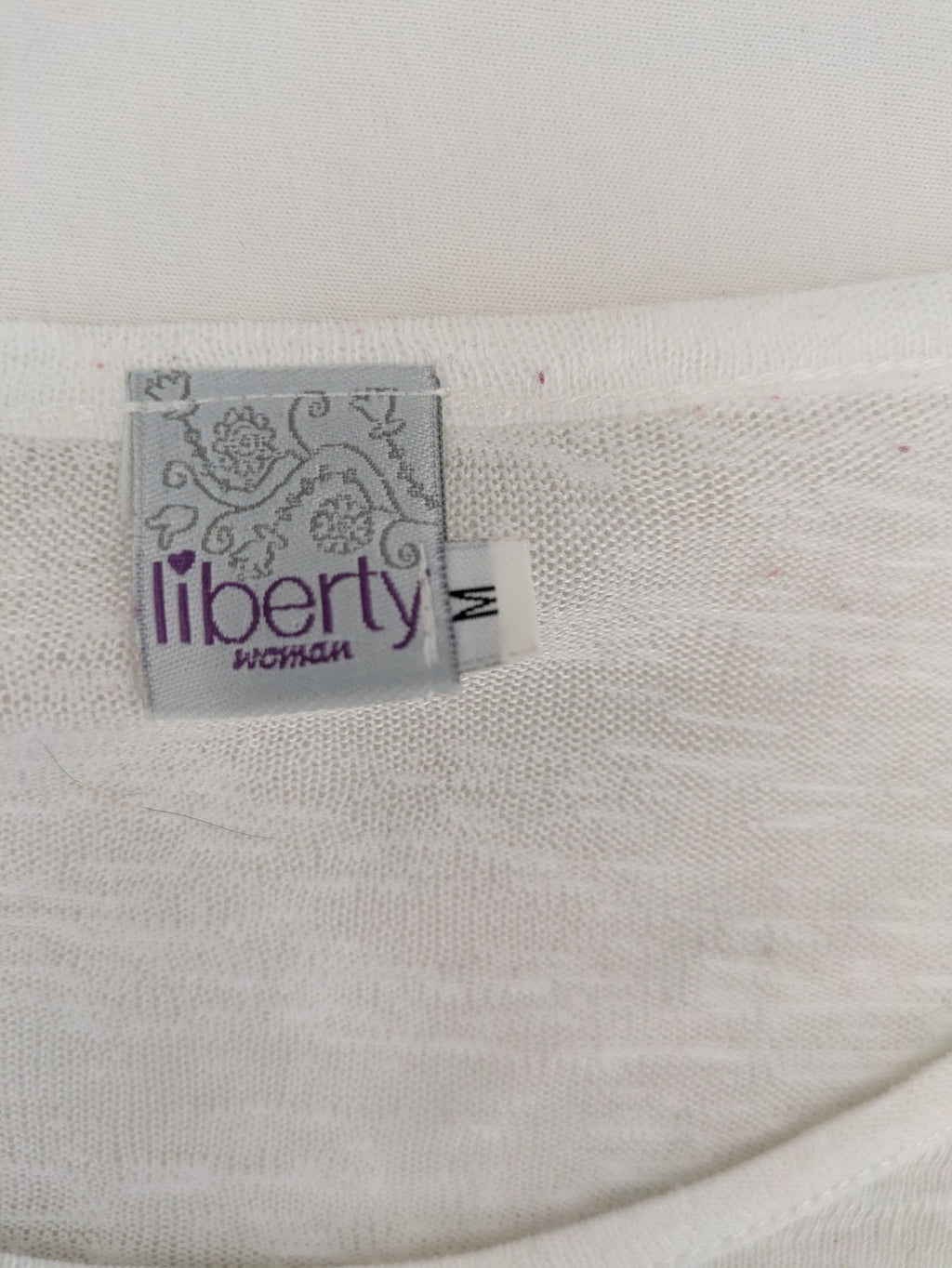 Liberty blue floral print top with metallic "LOVE" lettering, lightweight polyester material.