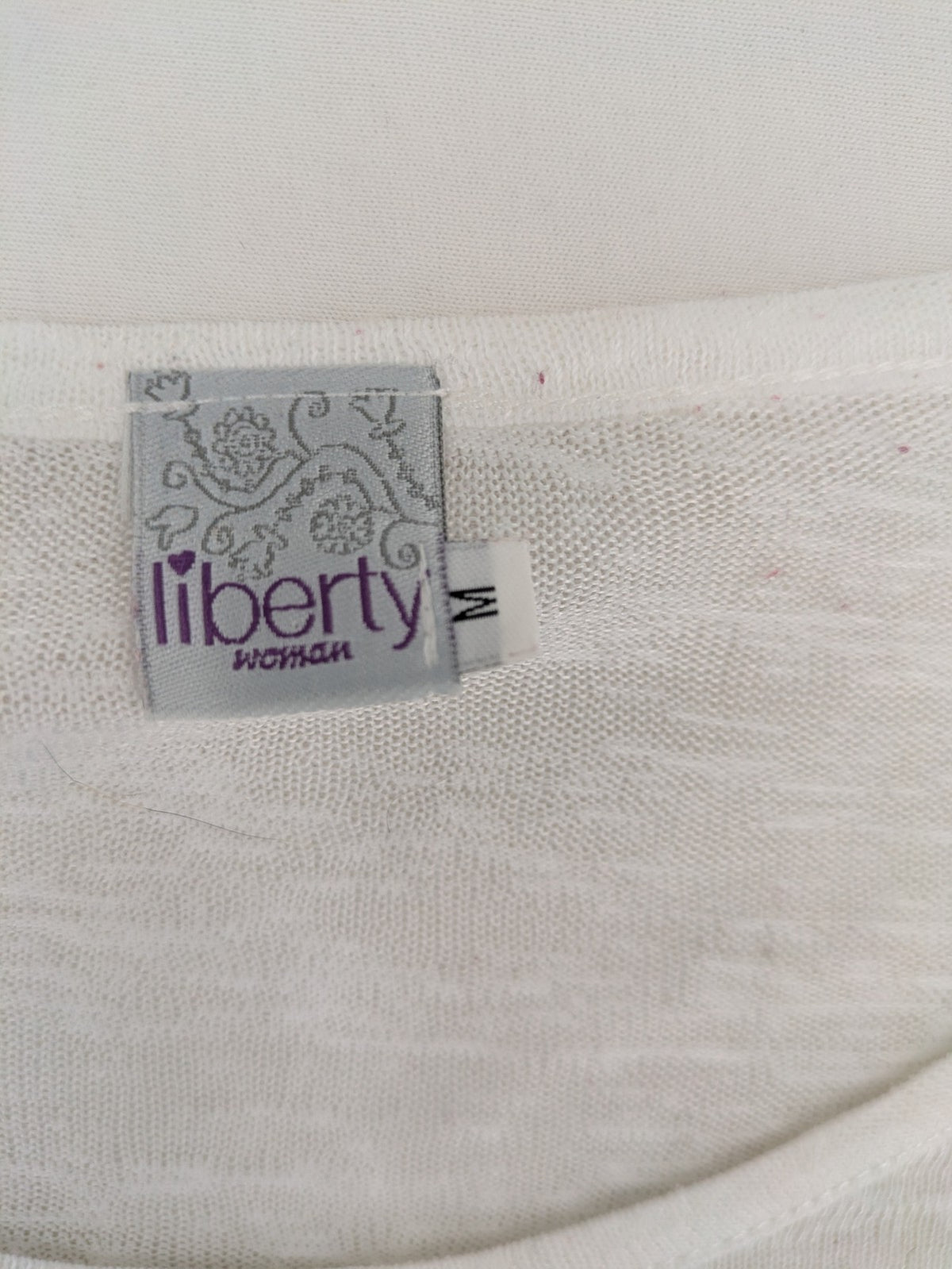 Liberty blue floral print top with metallic "LOVE" lettering, lightweight polyester material.
