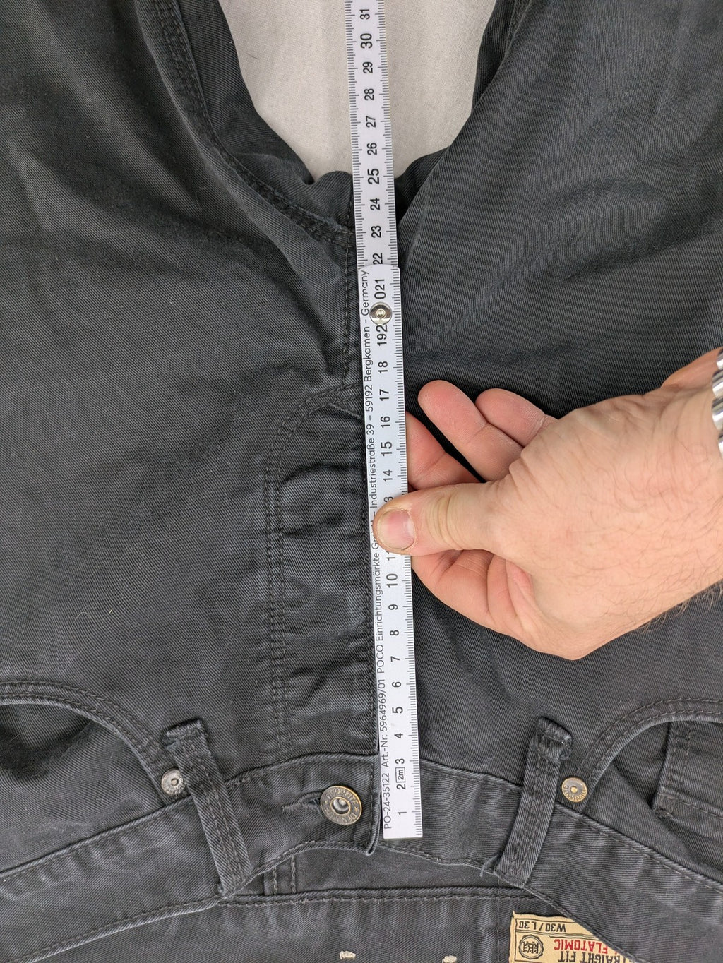 Ckh grey straight fit jeans with button fly and faded wash details.