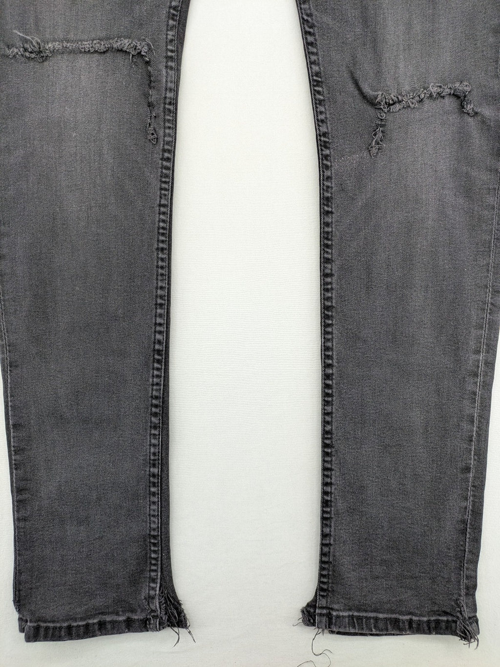 Only & Sons grey slim fit jeans with ripped details and open hem, stretch denim.