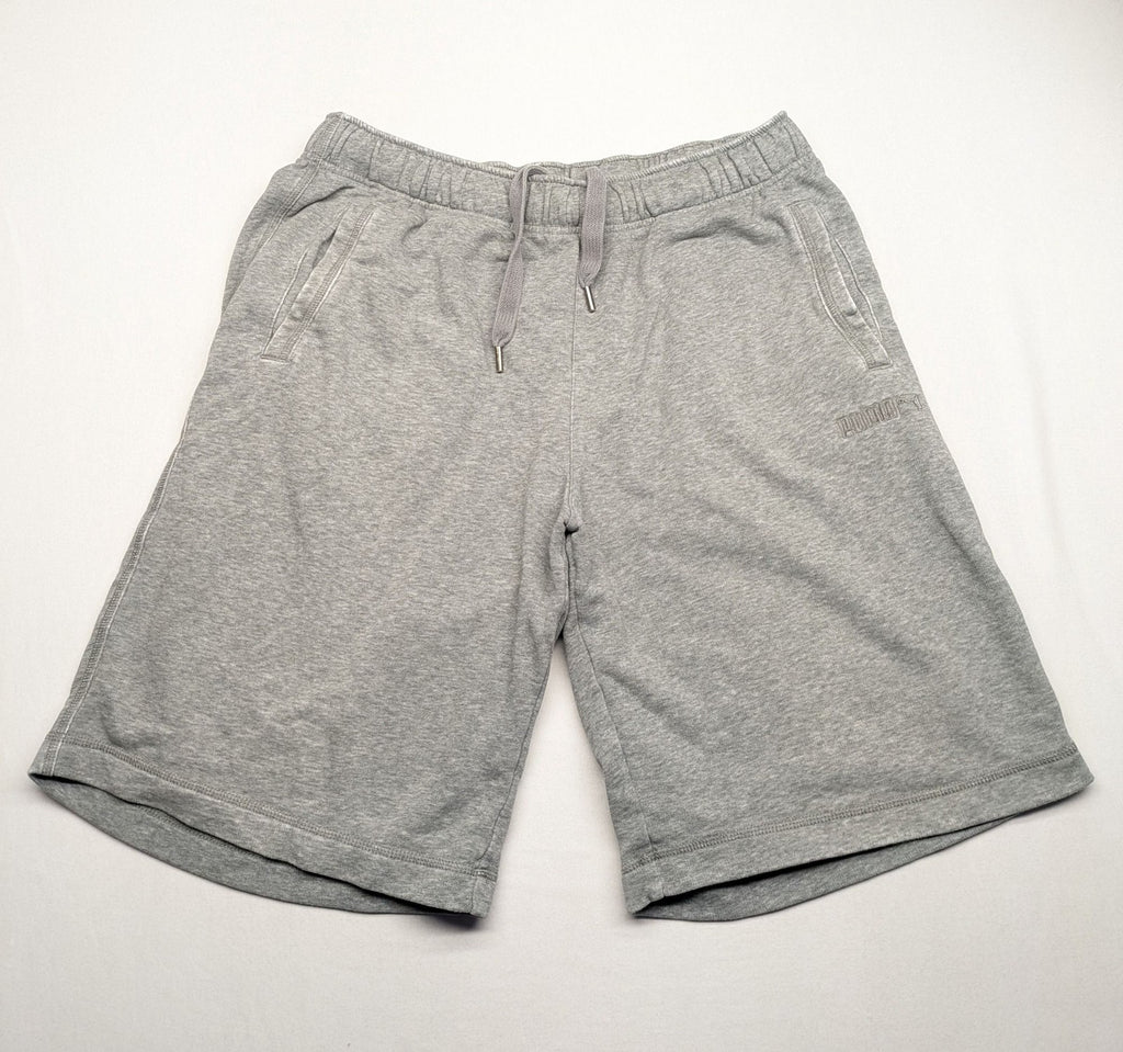 Puma grey sweat shorts with embroidered logo, made from cotton-polyester blend.