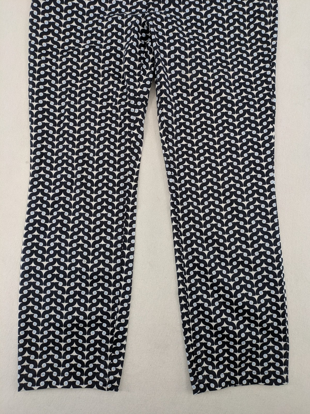 Bonita navy pants with geometric pattern, stretch material, and classic zip fly closure.