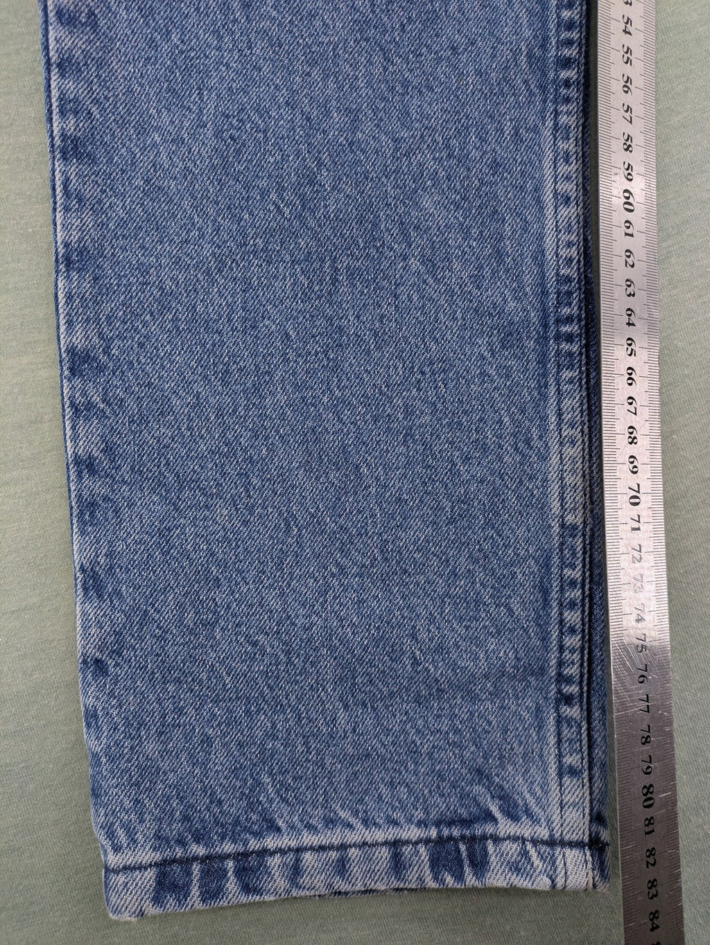 Wrangler blue straight jeans with button fly and classic 5-pocket design.