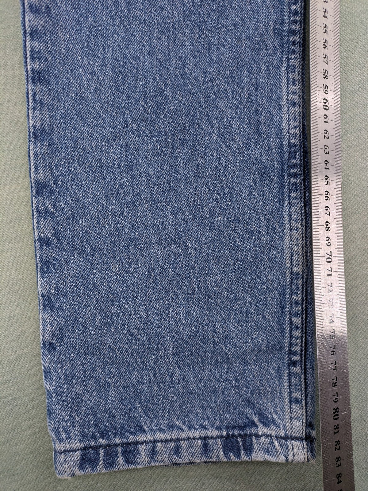 Wrangler blue straight jeans with button fly and classic 5-pocket design.