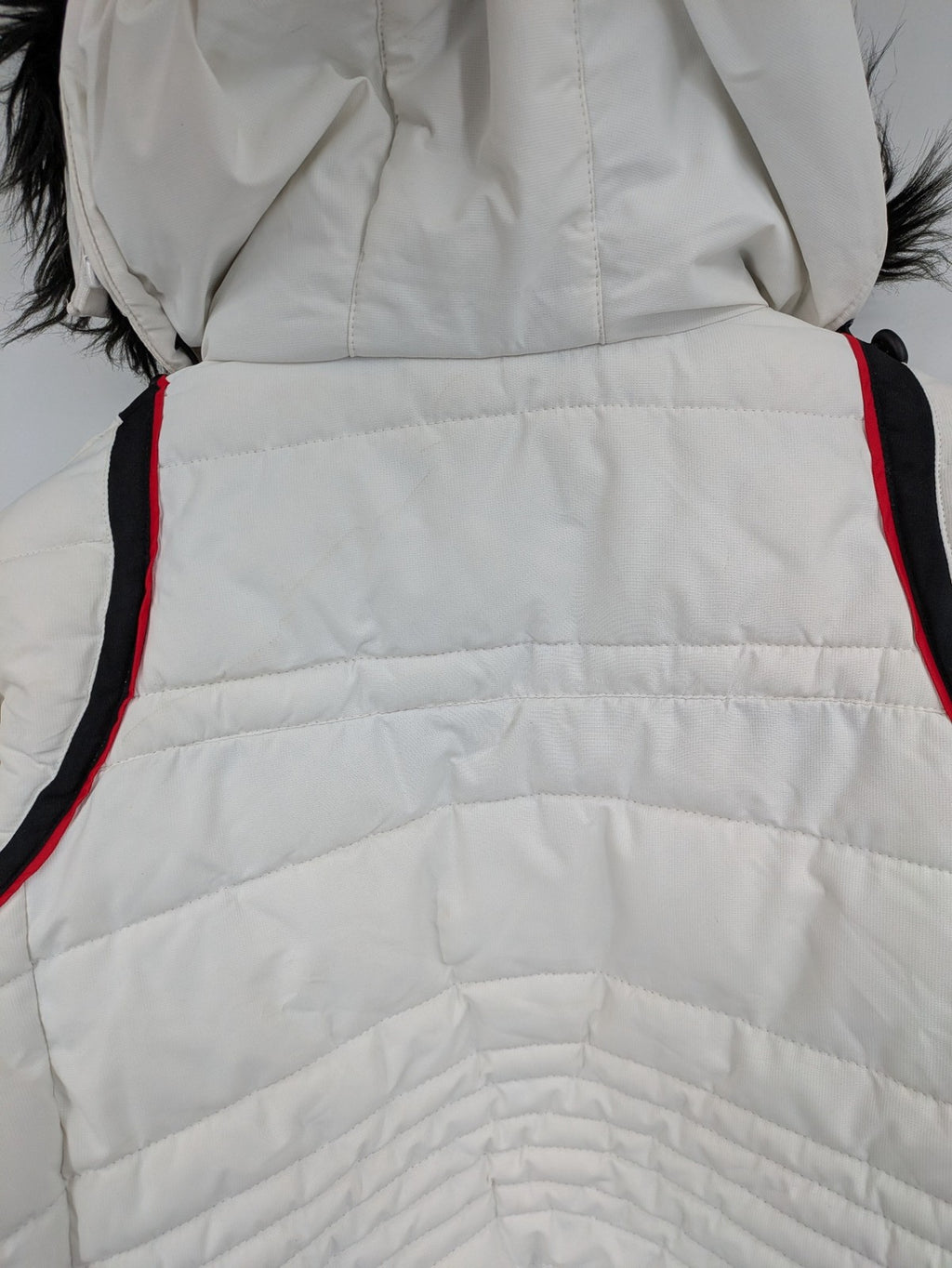 Janina white puffer jacket with quilted design and faux fur hood accents.