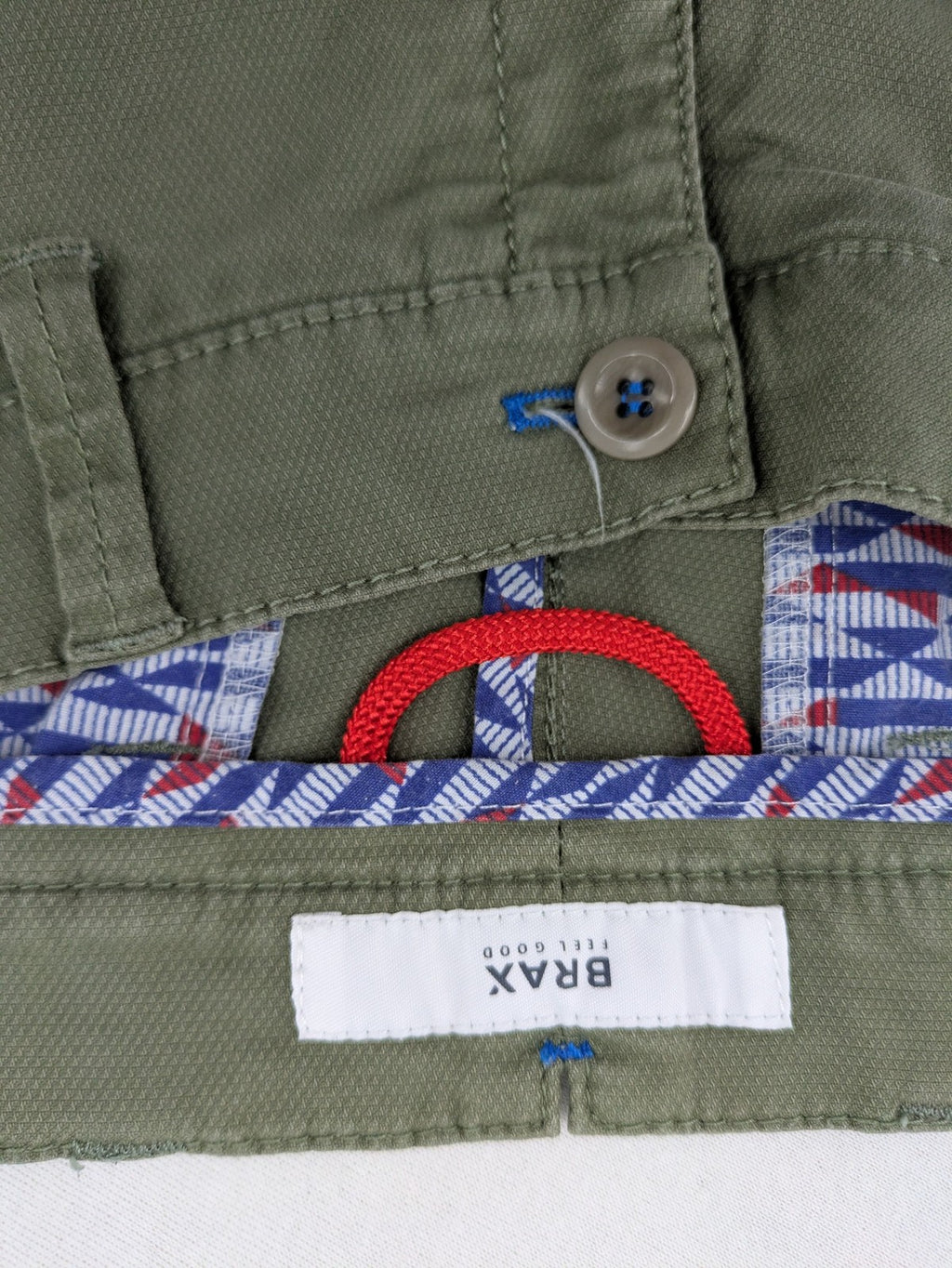 BRAX green chino pants flat-front design with zipper and buttoned back pockets.