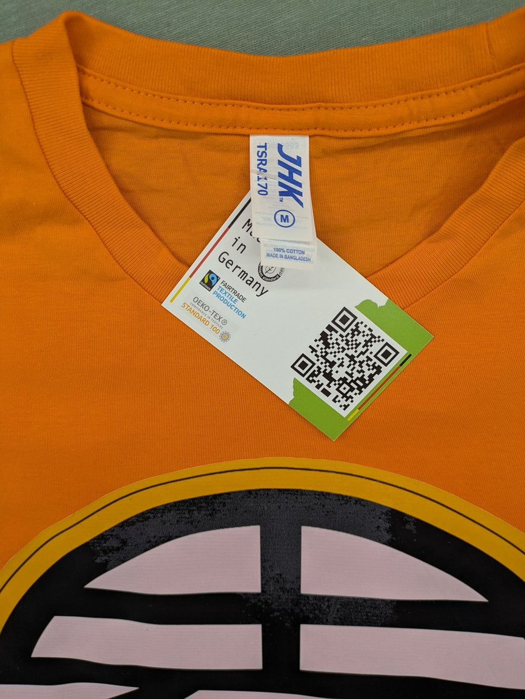 Dragon Ball Z orange t-shirt featuring 'Go' kanji symbol, made of soft cotton.