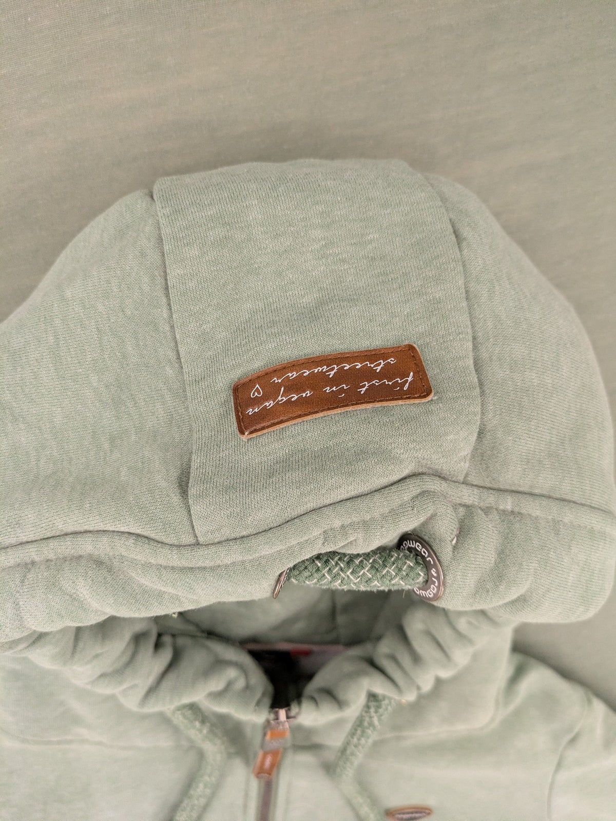 Ragwear grey hoodie jacket with high collar, thick drawstrings, and vegan materials.