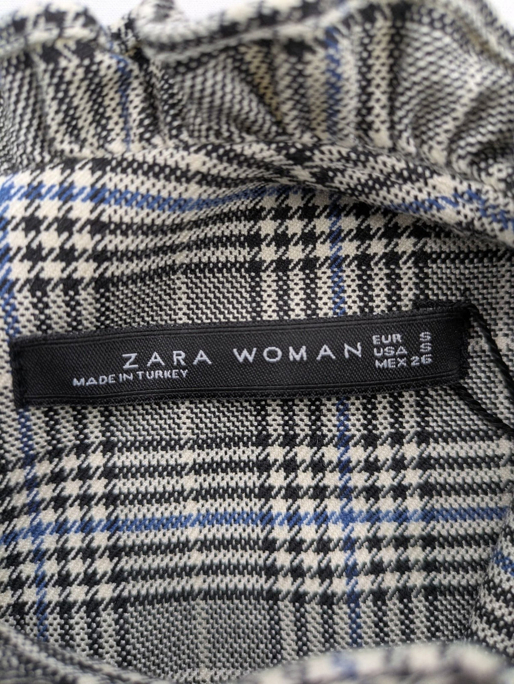 Zara ruffled sleeveless blouse grey check pattern high ruffle collar with blue, black, white accents