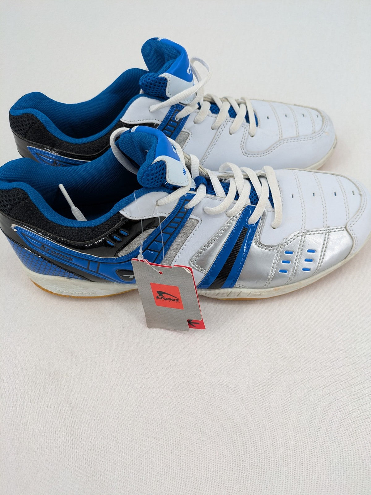 Kronos sports sneakers white, blue, and silver with durable rubber sole and classic design.