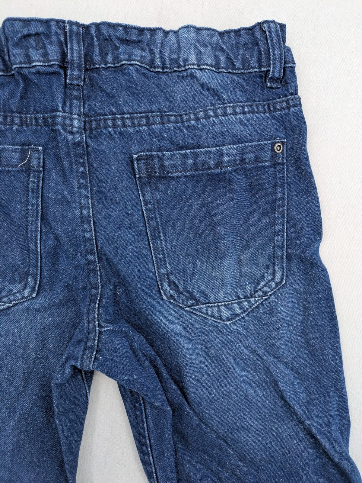 Pocopiano blue denim shorts with rolled cuffs and elastic waistband for comfort.