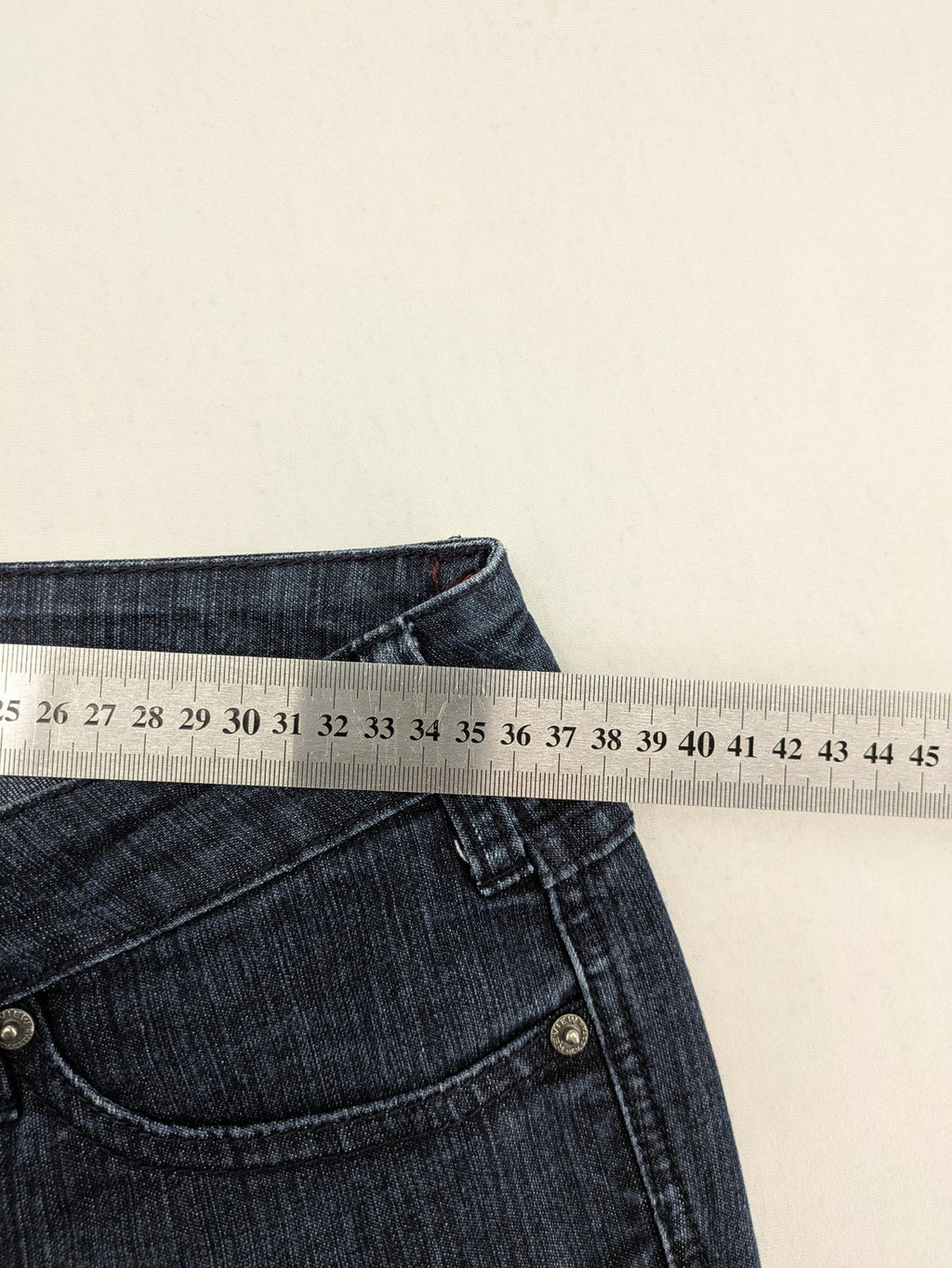 Review straight leg jeans dark blue low rise stretch denim with classic design.