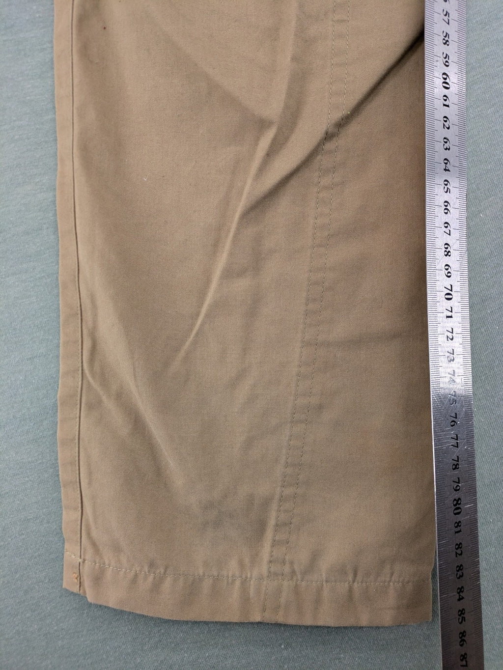 Fjällräven beige pants regular fit durable fabric outdoor style with logo detail.
