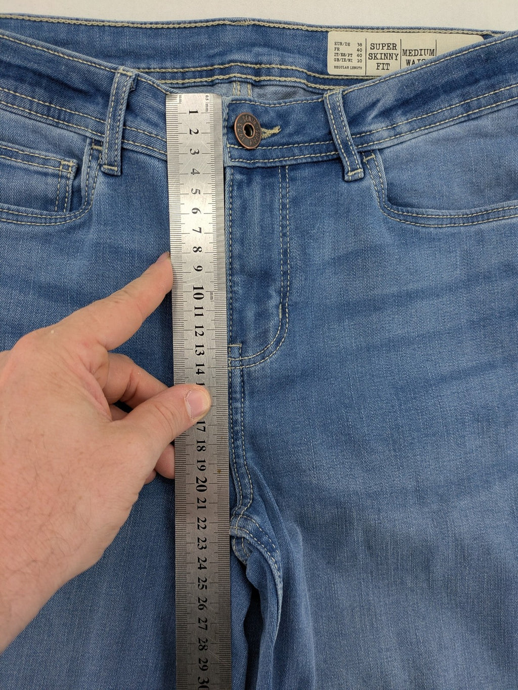 ESMARA blue super skinny jeans with medium waist and stretchy cotton blend material.