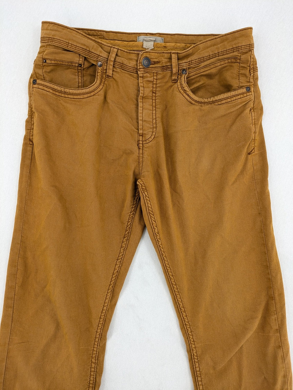 Bershka brown straight jeans slim fit classic 5-pocket design with prominent stitching.