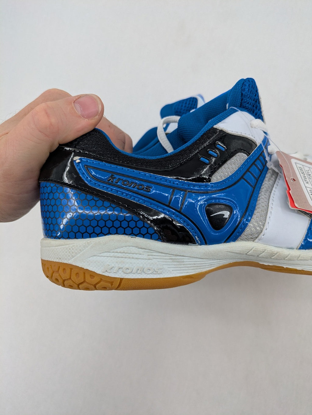 Kronos sports sneakers white, blue, and silver with durable rubber sole and classic design.