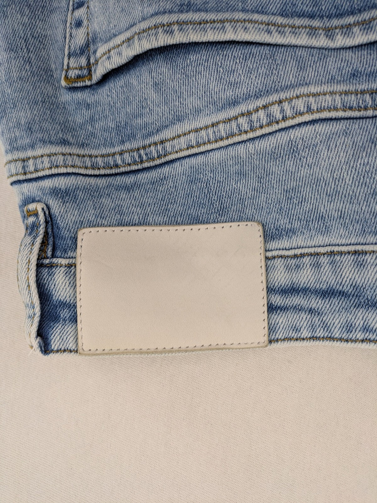 Oskar blue slim fit jeans with classic 5-pocket design and light wash.