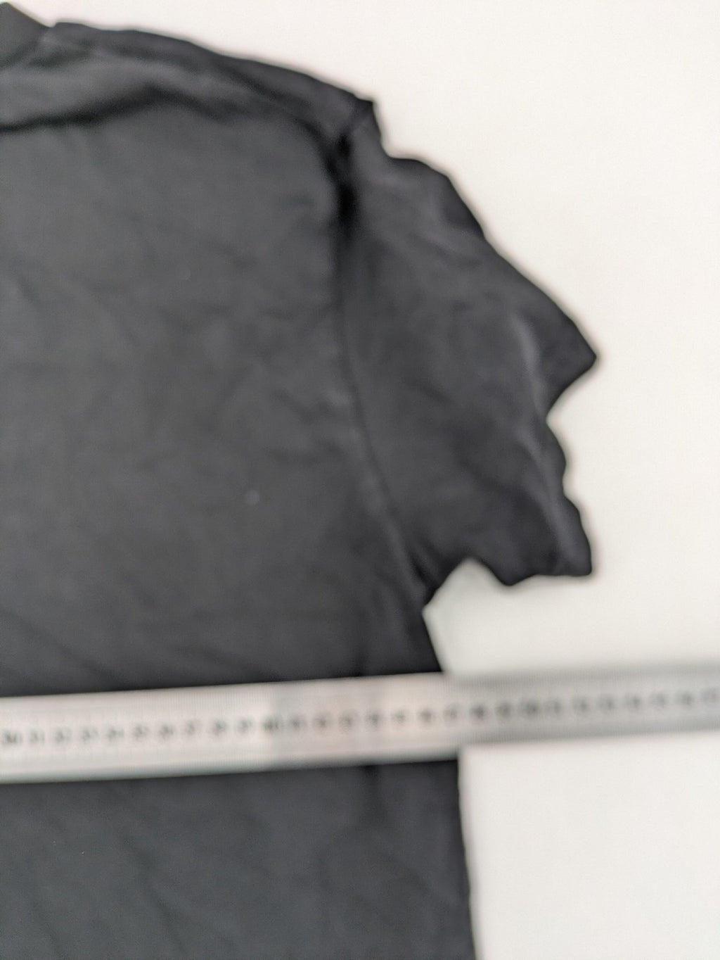 Dsquared2 grey short sleeve shirt with red maple leaf and smiley face graphic.