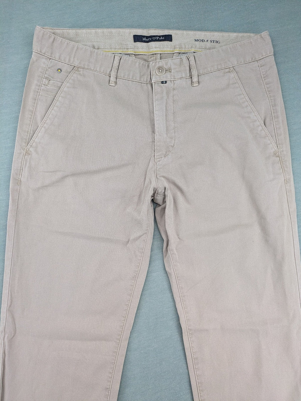 Marc O'Polo beige tapered fit chino pants, soft cotton stretch fabric, modern silhouette.