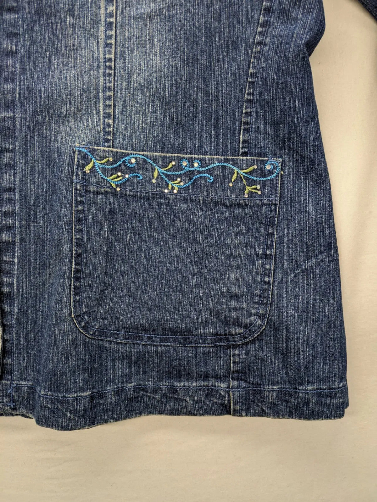 Zala blue denim blazer jacket with embroidered details and classic button closure.