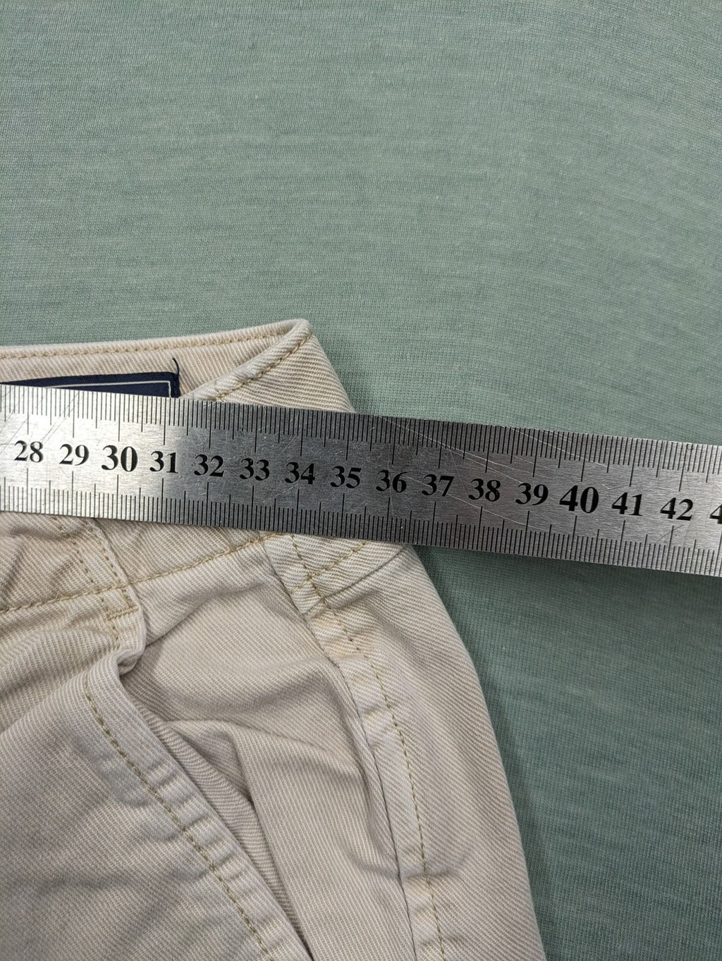 Gap beige loose-fit chino pants made from 100% cotton with relaxed wide-leg design.
