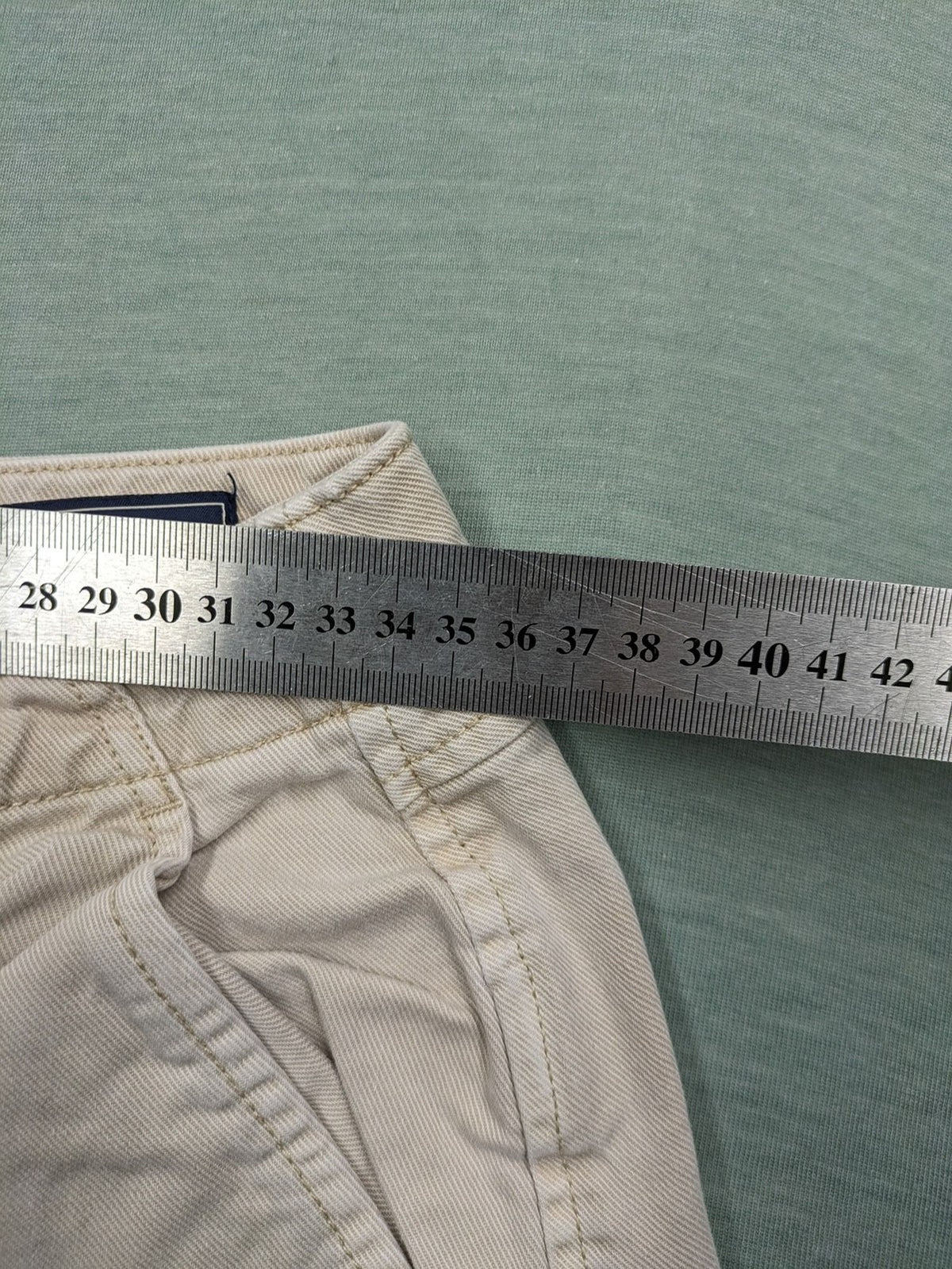 Gap beige loose-fit chino pants made from 100% cotton with relaxed wide-leg design.