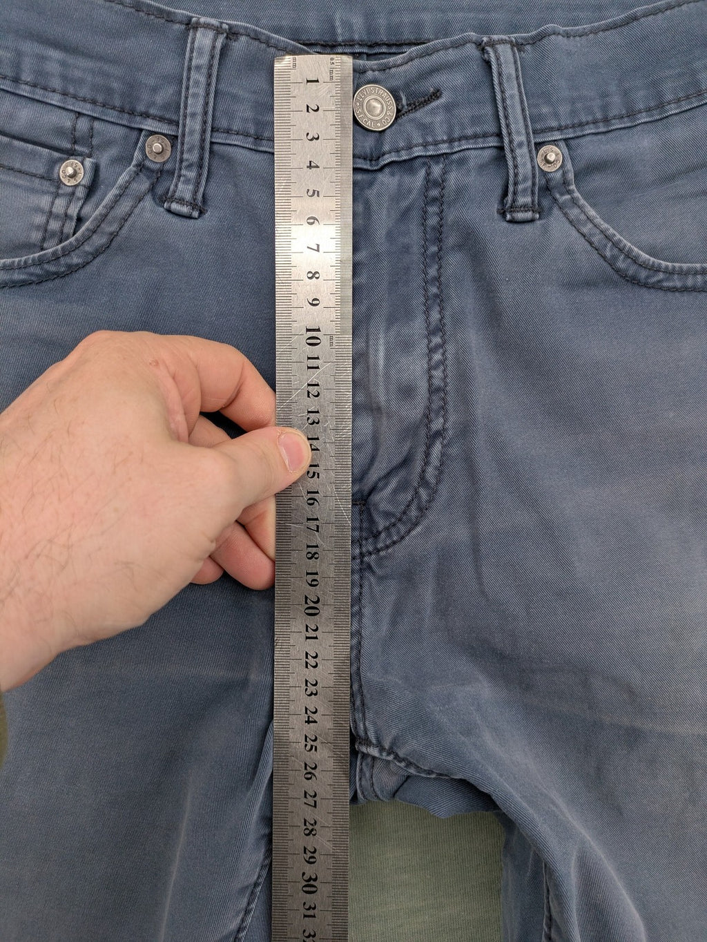 Levi's blue slim fit jeans with faded wash and classic 5-pocket design.