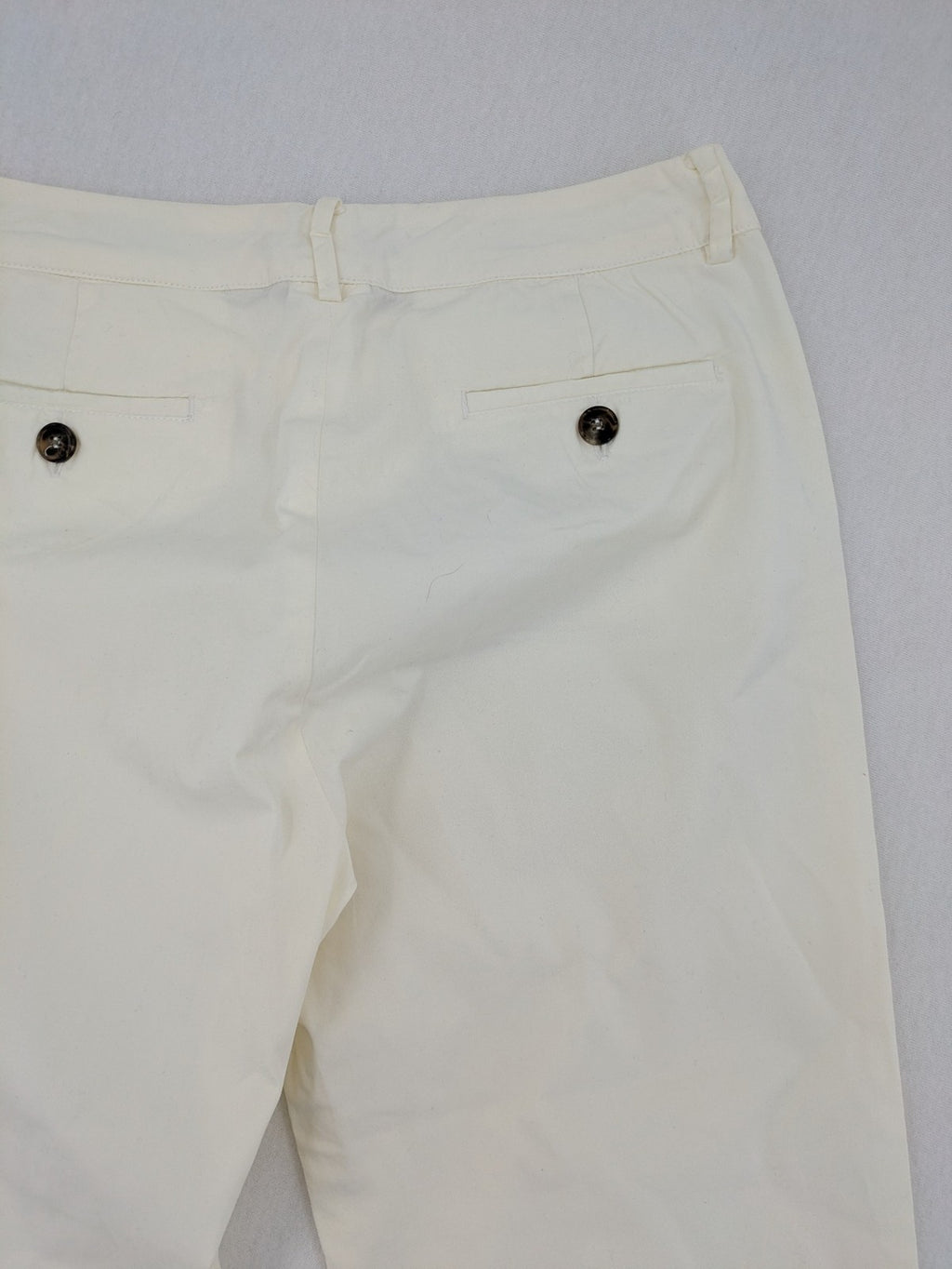 MaxMara cream cropped chino pants with zipper closure, belt loops, and back pockets.
