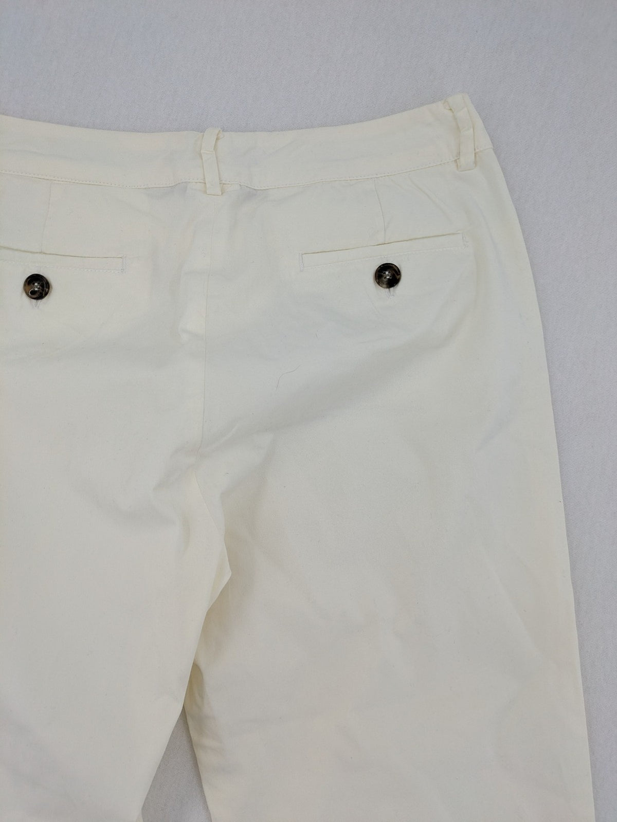 MaxMara cream cropped chino pants with zipper closure, belt loops, and back pockets.