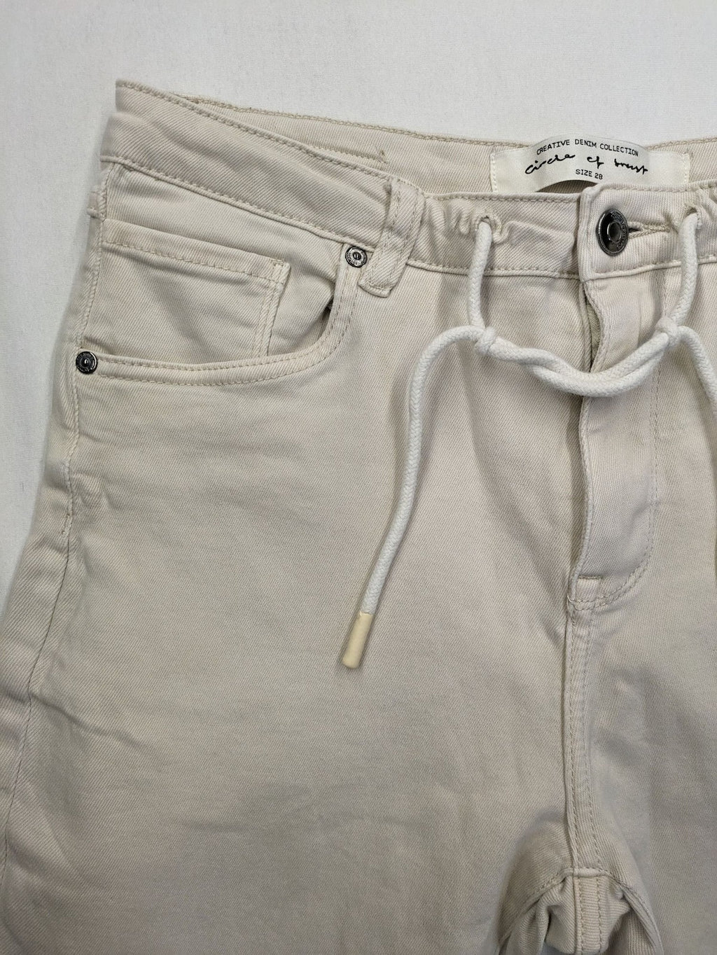 Circle Of Trust beige straight jeans with elastic waistband, drawstring, and classic 5-pocket design.