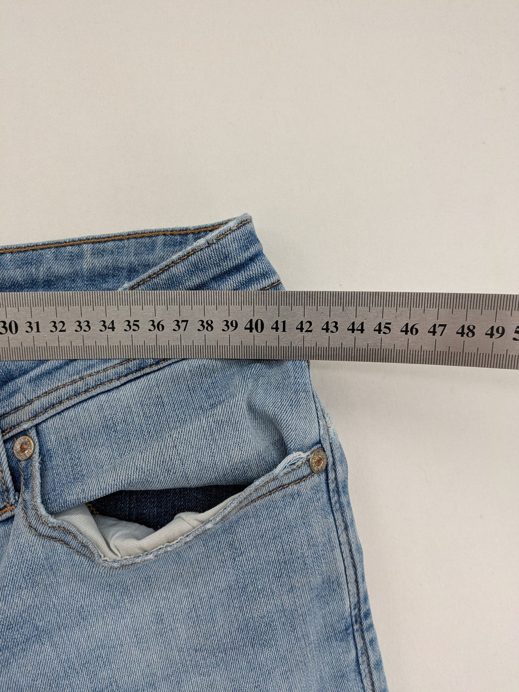 Jack & Jones blue slim jeans with button fly and subtle used look.