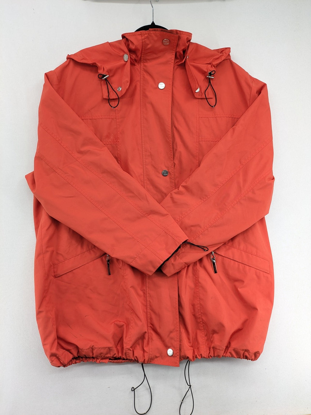 Sport Windbreaker orange jacket with adjustable hood, full zip, and button storm flap.