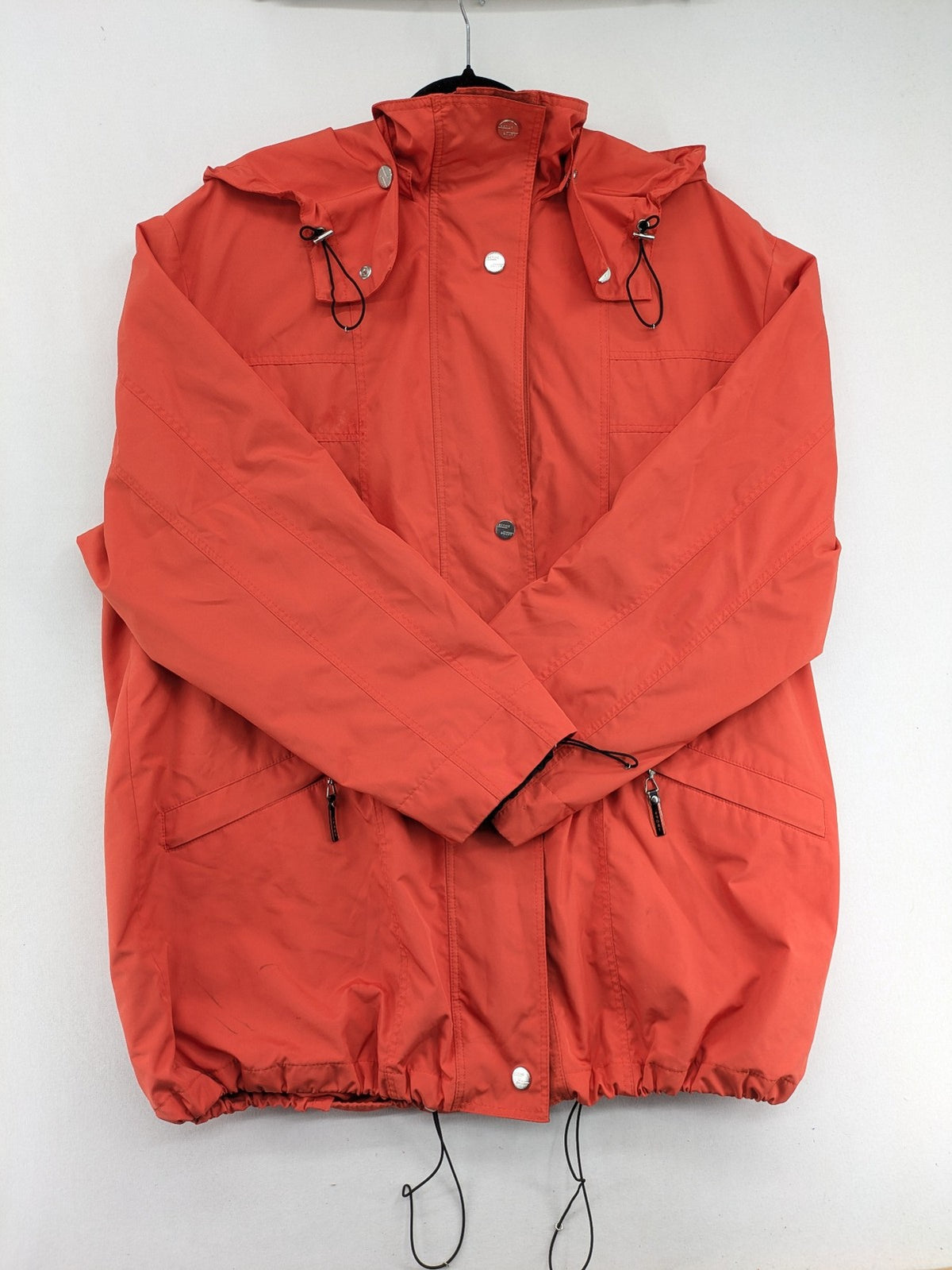 Sport Windbreaker orange jacket with adjustable hood, full zip, and button storm flap.
