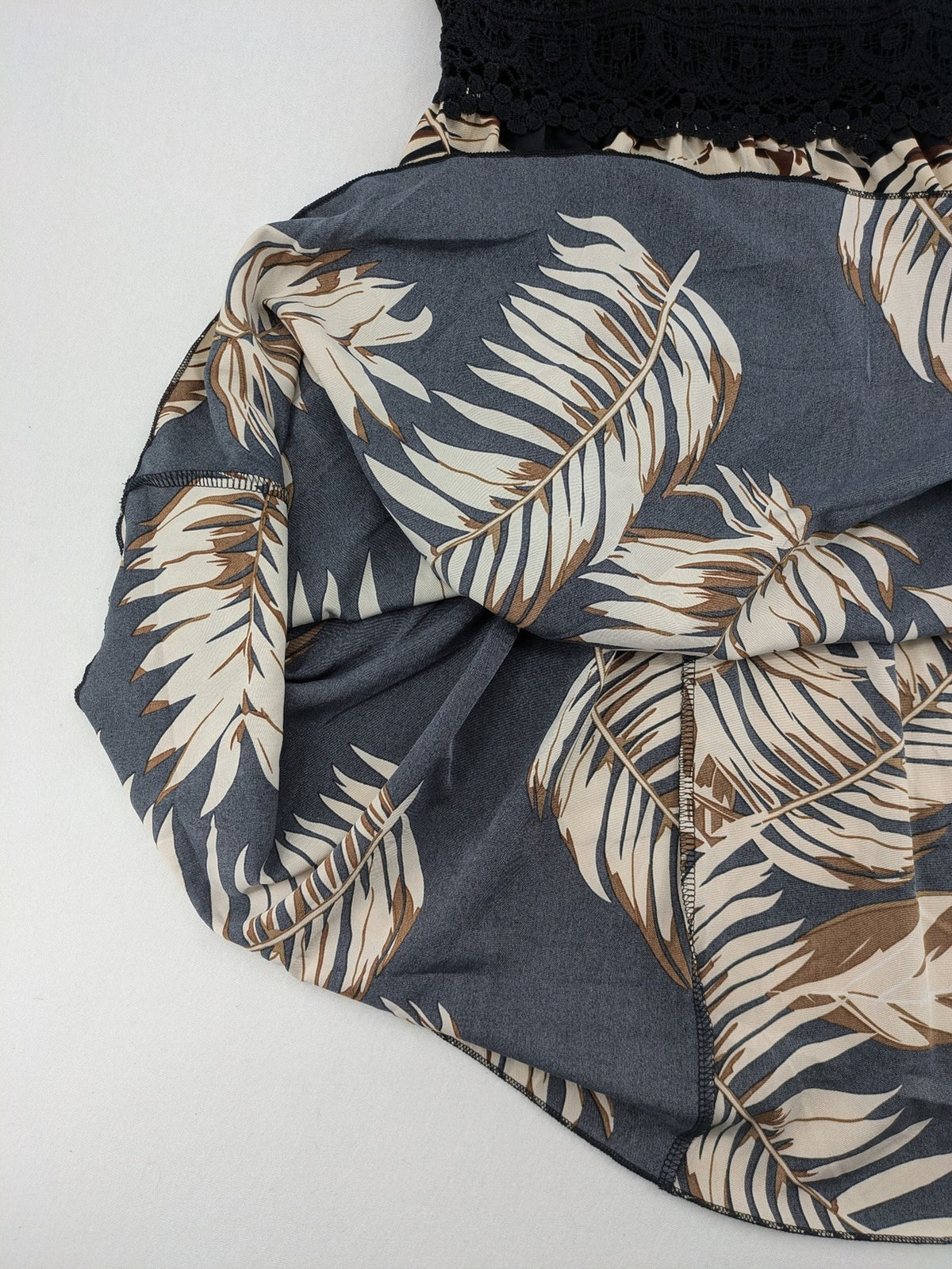 Kontrast summer dress beige tropical leaf print with black ribbed tank top and lace trim.