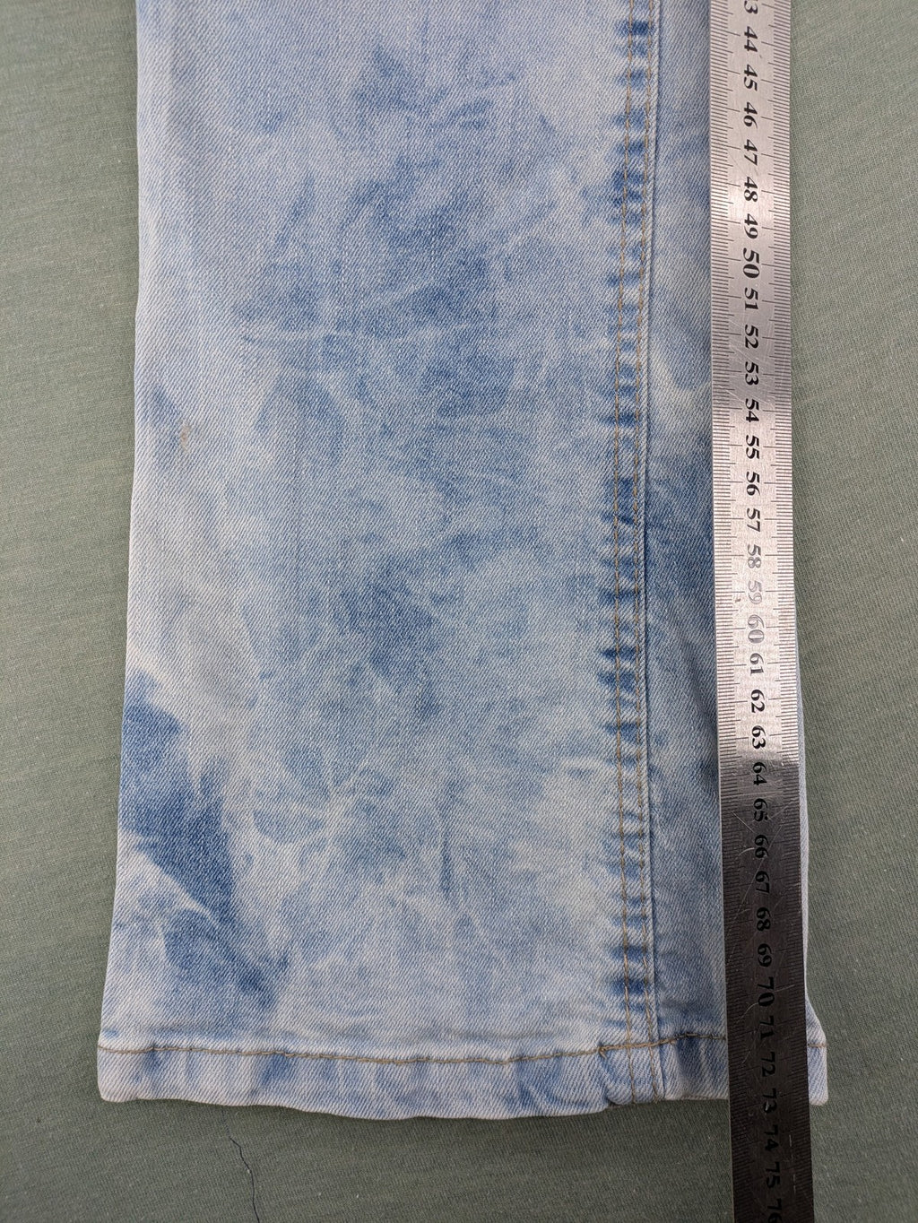 Arizona blue flare jeans with acid wash, button fly, and stretch denim material.