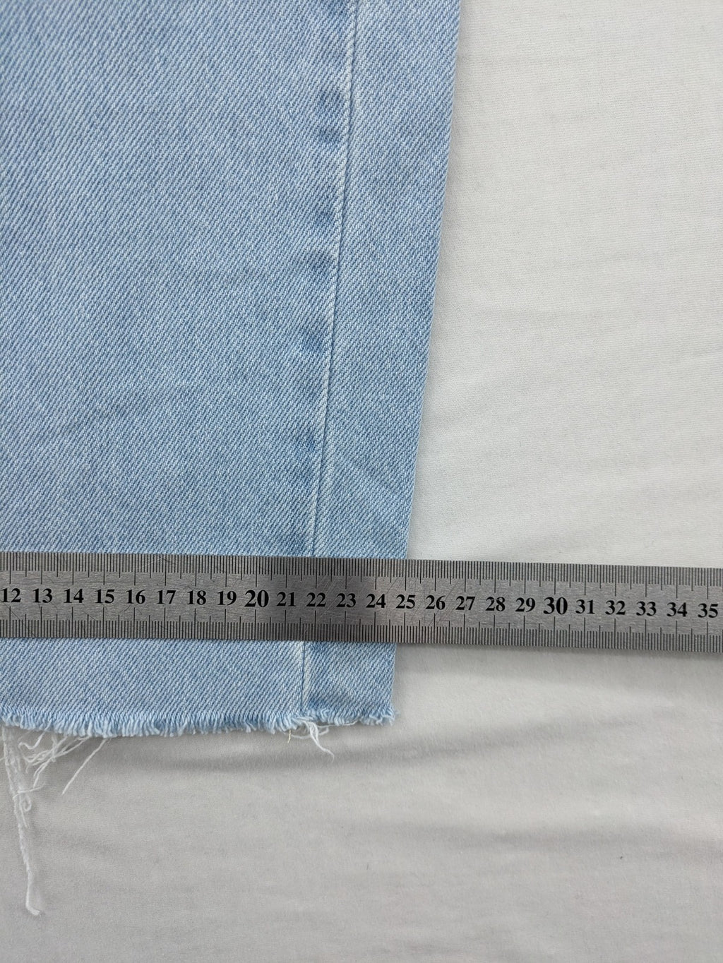 MNG blue straight jeans with cargo pockets and raw hem, high waist denim.