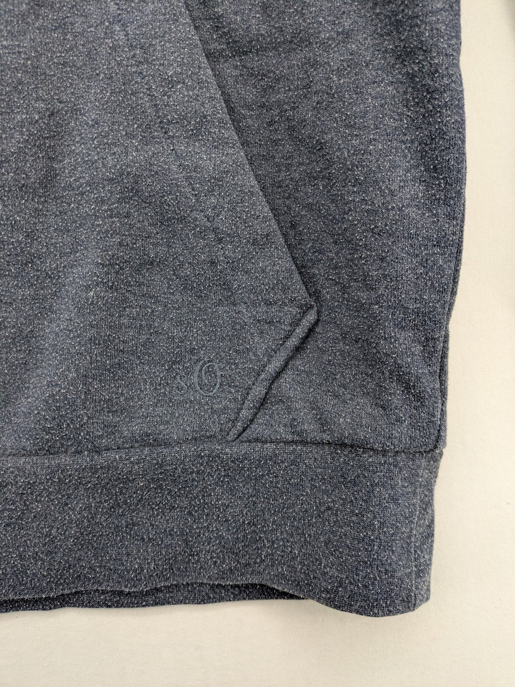 s.Oliver green turtle neck sweatshirt with adjustable drawstrings and graphic detail on sleeve