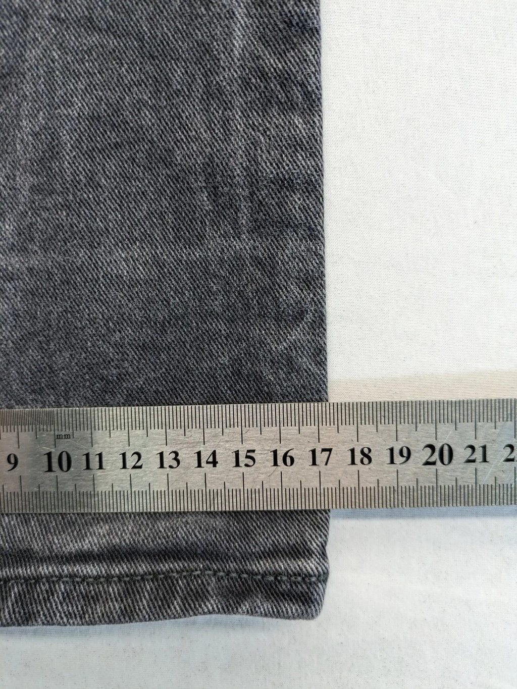 COS grey straight jeans with classic 5-pocket style and washed denim texture.