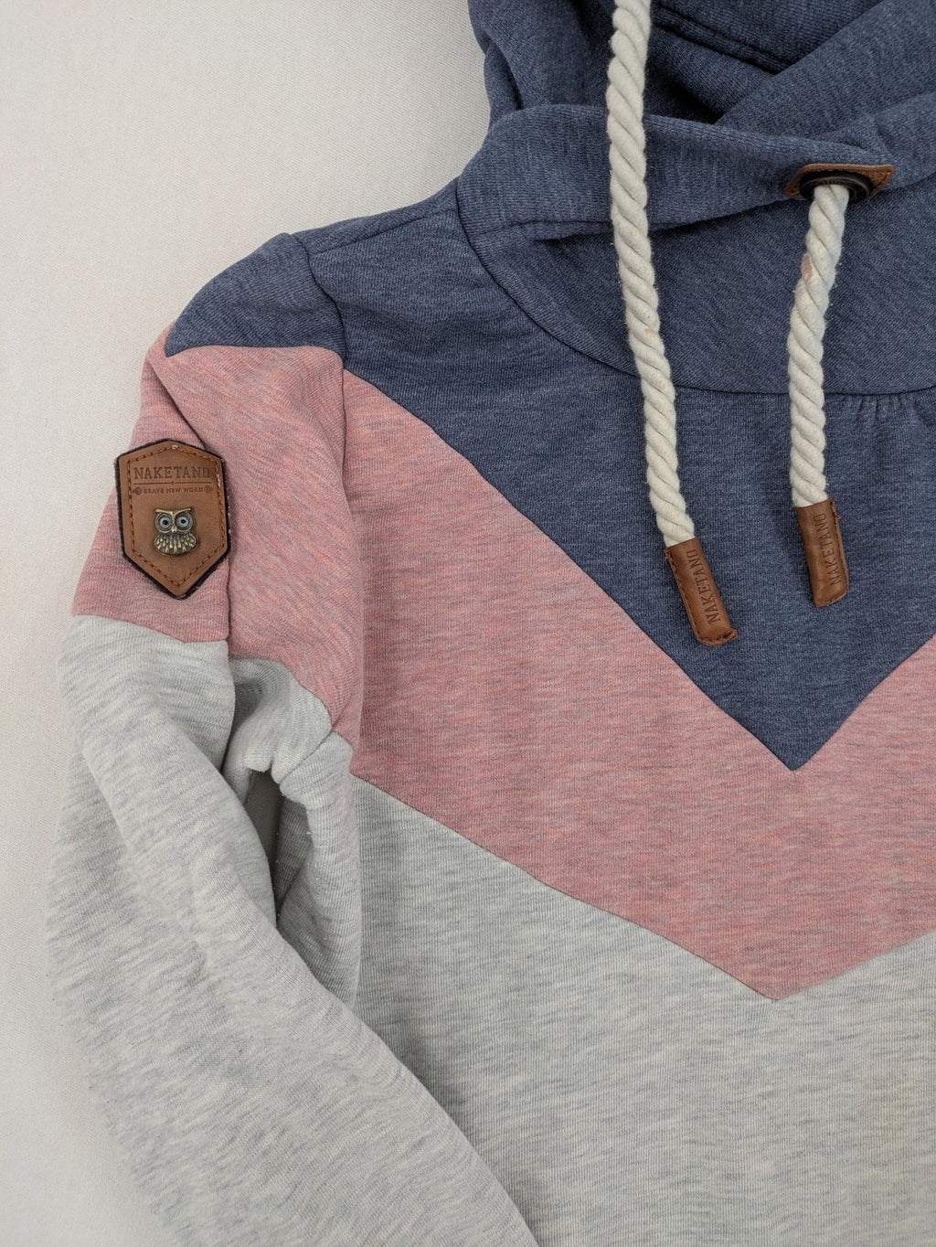 Naketano multi turtle neck jumper colorblock design in blue, pink, and grey.